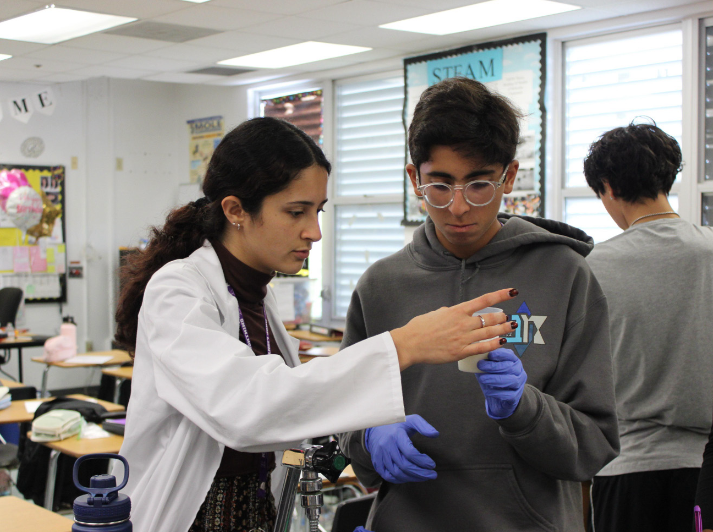 HANDS ON: Ms.Assraf’s third period class identifies chemical and physical changes through multiple different
experiments.